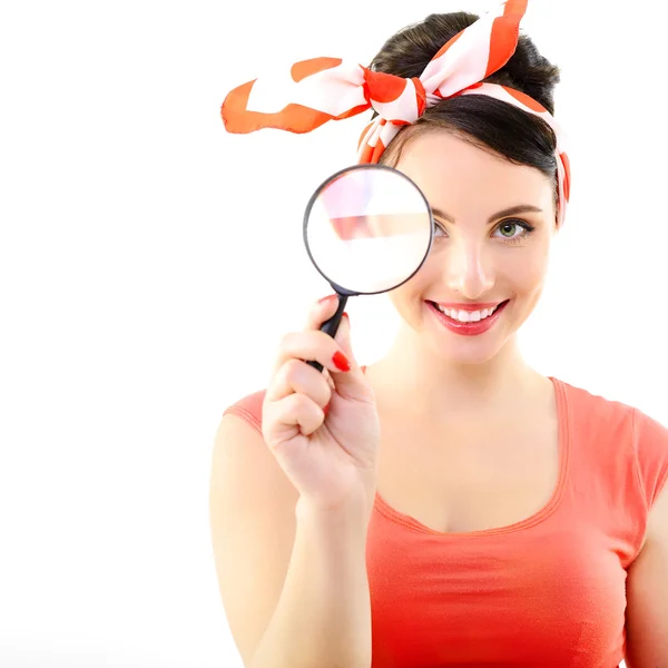 Pinup girl with magnifying glass — Stock Photo, Image