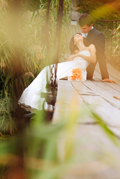 beautiful bride with goom  on the bridge