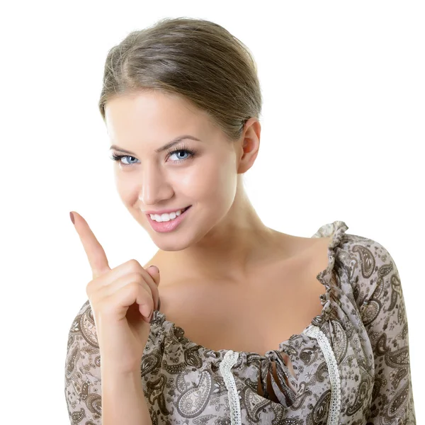 Kvinna som pekar uppåt med fingret — Stockfoto