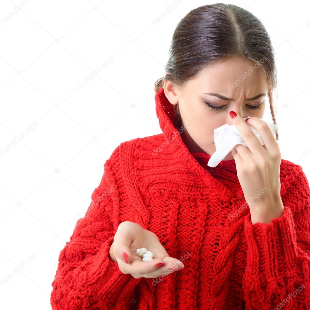 woman having flue taking pills