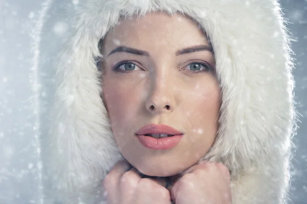 Portrait of a young woman wearing a fur cap — Stock Photo, Image