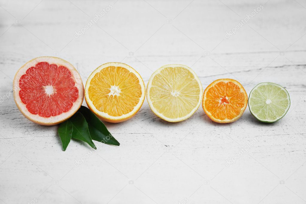 Citrus fruits on white wood