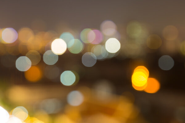 Bokeh of lights in the city. Bokeh of lights that turn on in the evening on the town.