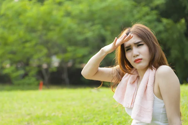 Woman sitting rest after exercise — Stock Photo, Image