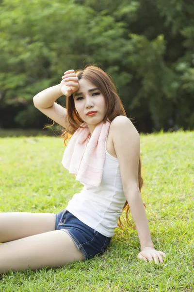 Woman sitting rest after exercise — Stock Photo, Image