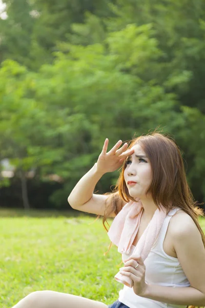 Woman sitting rest after exercise — Stock Photo, Image