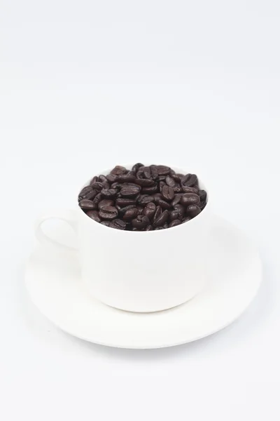 Coffee cup with coffee beans — Stock Photo, Image