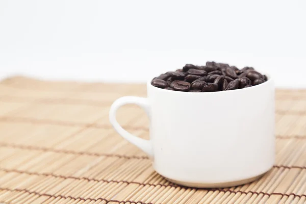 Glass of white coffee beans — Stock Photo, Image