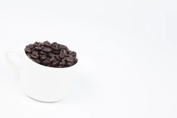 Coffee cup with coffee beans — Stock Photo, Image