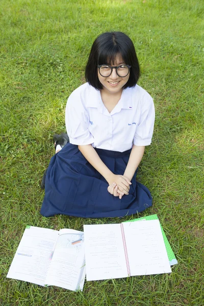 Girl reading on the lawn. — Stock Photo, Image