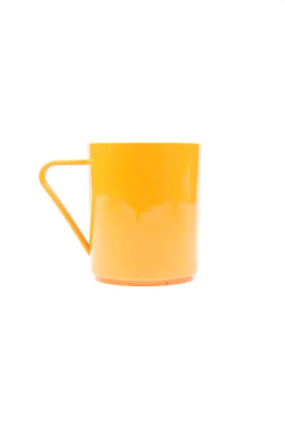 Orange plastic glass on a white background. — Stock Photo, Image