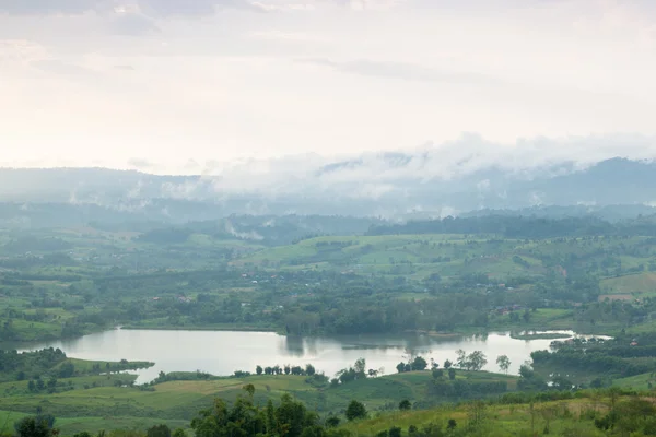 Mist covered mountains and farmland. — Stock Photo, Image