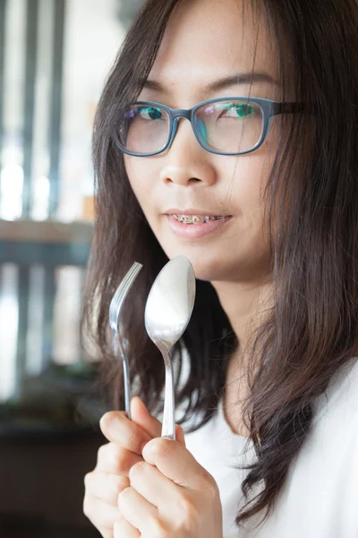 Asia woman hold spoon and fork — Stock Photo, Image