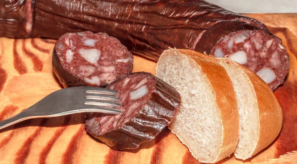 Sausage and bread on a stand — Stock Photo, Image