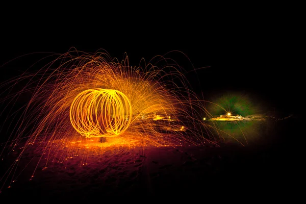 Fire painting, light painting with sparks at winter — Stock Photo, Image