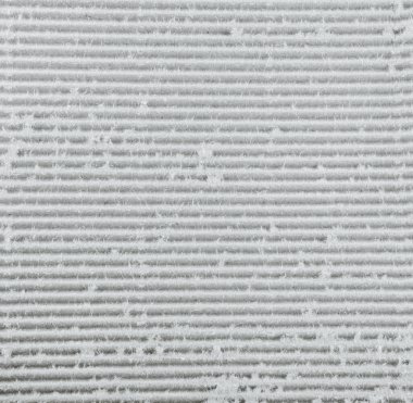 Karton desen pürüzsüz. Oluklu fiberboard flütlü bir çarşaf ve bir ya da iki düz tahta içeren bir malzemedir..