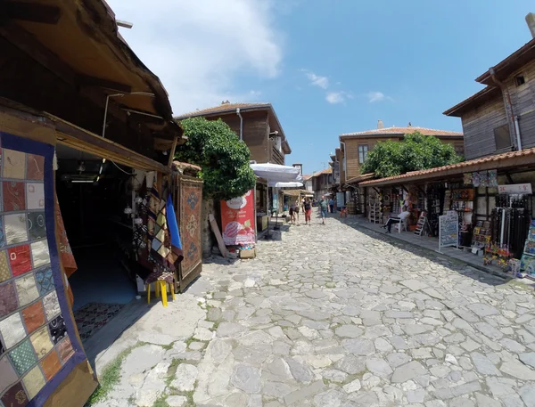 NESSEBAR, BULGARIA - JUNE 16: People visit Old Town on June 16, 2014 in Nessebar, Bulgaria. Nessebar in 1956 was declared as museum city, archaeological and architectural reservation by UNESCO. — Stock Photo, Image