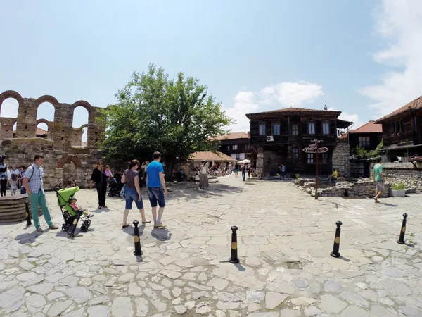 NESSEBAR, BULGARIA - JUNE 16: People visit Old Town on June 16, 2014 in Nessebar, Bulgaria. Nessebar in 1956 was declared as museum city, archaeological and architectural reservation by UNESCO. — Stock Photo, Image