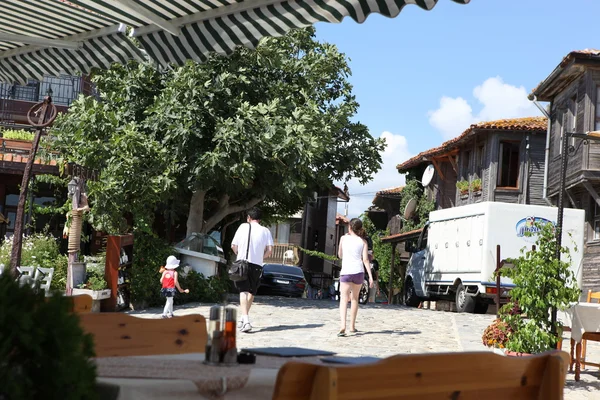 NESEBAR, BULGARIA - AUGUST 29: People visit Old Town on August 29, 2014 in Nesebar, Bulgaria. Nesebar in 1956 was declared as museum city, archaeological and architectural reservation by UNESCO. — Stock Photo, Image