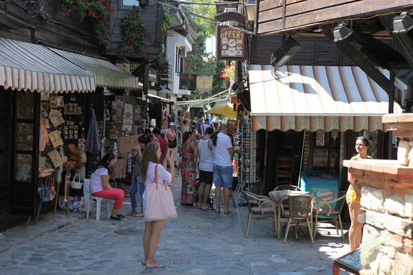 NESEBAR, BULGARIA - AUGUST 29: People visit Old Town on August 29, 2014 in Nesebar, Bulgaria. Nesebar in 1956 was declared as museum city, archaeological and architectural reservation by UNESCO. — Stock Photo, Image