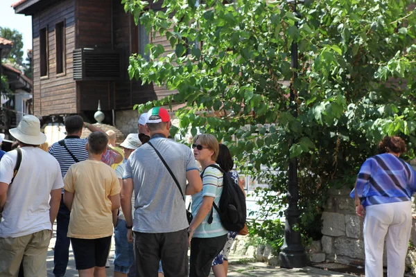 NESEBAR, BULGARIA - AUGUST 29: People visit Old Town on August 29, 2014 in Nesebar, Bulgaria. Nesebar in 1956 was declared as museum city, archaeological and architectural reservation by UNESCO. — Stock Photo, Image