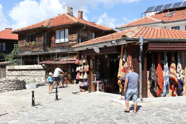 NESEBAR, BULGARIA - AUGUST 29: People visit Old Town on August 29, 2014 in Nesebar, Bulgaria. Nesebar in 1956 was declared as museum city, archaeological and architectural reservation by UNESCO. — Stock Photo, Image