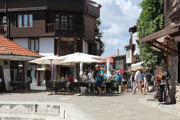 NESEBAR, BULGARIA - AUGUST 29: People visit Old Town on August 29, 2014 in Nesebar, Bulgaria. Nesebar in 1956 was declared as museum city, archaeological and architectural reservation by UNESCO. — Stock Photo, Image