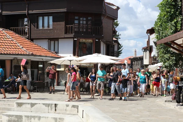 NESEBAR, BULGARIA - AUGUST 29: People visit Old Town on August 29, 2014 in Nesebar, Bulgaria. Nesebar in 1956 was declared as museum city, archaeological and architectural reservation by UNESCO. — Stock Photo, Image