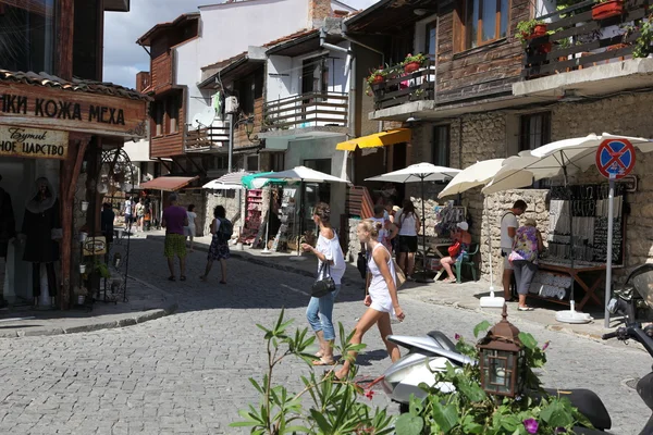 NESEBAR, BULGARIA - AUGUST 29: People visit Old Town on August 29, 2014 in Nesebar, Bulgaria. Nesebar in 1956 was declared as museum city, archaeological and architectural reservation by UNESCO. — Stock Photo, Image