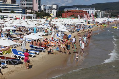 SUNNY BEACH, BULGARIA - AUGUST 29: People visit Sunny Beach on August 29, 2014. Sunny Beach is the largest and most popular seaside beach resort in Bulgaria. clipart