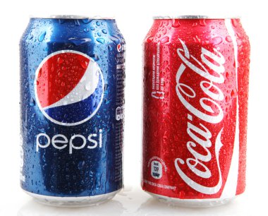 AYTOS, BULGARIA - DECEMBER 11, 2014: Photo of a Coca-Cola and Pepsi 330 ml cans. Coca-cola and Pepsi are among the most popular carbonated drinks in the world. clipart