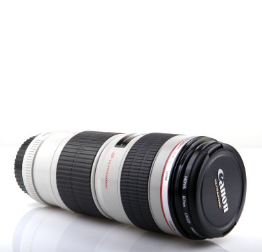 AYTOS, BULGARIA - AUGUST 11, 2015: Canon EF 70-200mm f/4L USM Lens. Canon Inc. is a Japanese multinational corporation specialized in the manufacture of imaging and optical products. clipart