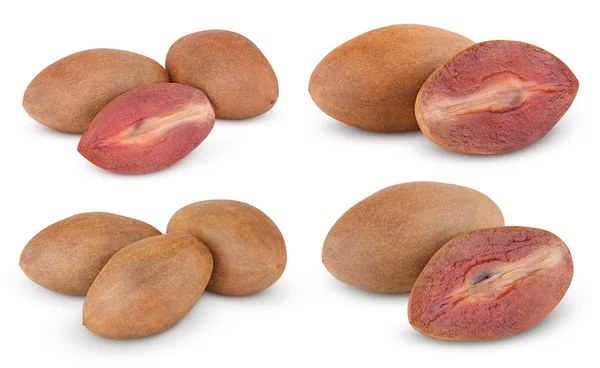 Fresh sapodilla plums with cut on white — Stock Photo, Image