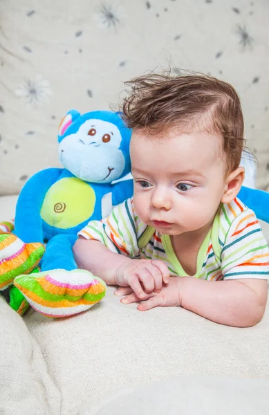 Baby boy with monkey — Stock Photo, Image