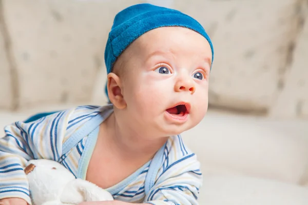 Baby boy playing with bunny — Stock Photo, Image