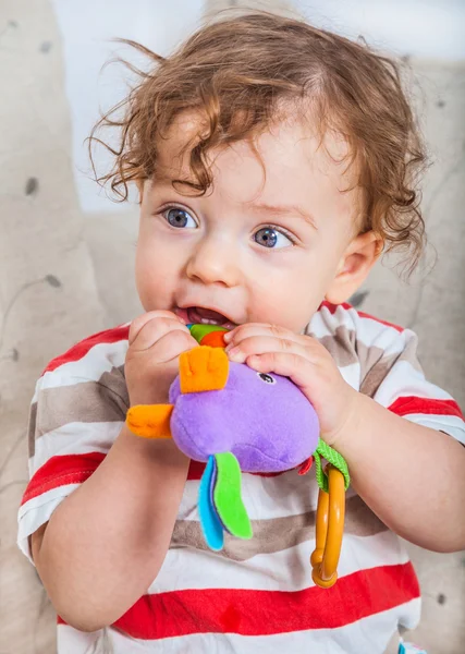 Baby boy chewing on toy — Stock Photo, Image