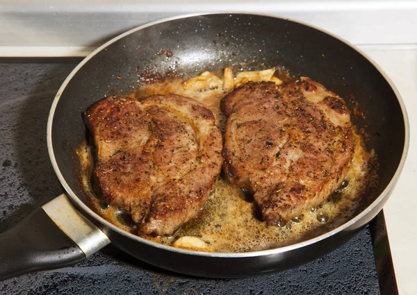 Two juicy fresh steak in the pan