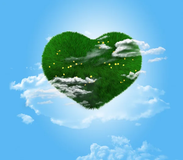 Green heart on a blue background. — Stock Photo, Image