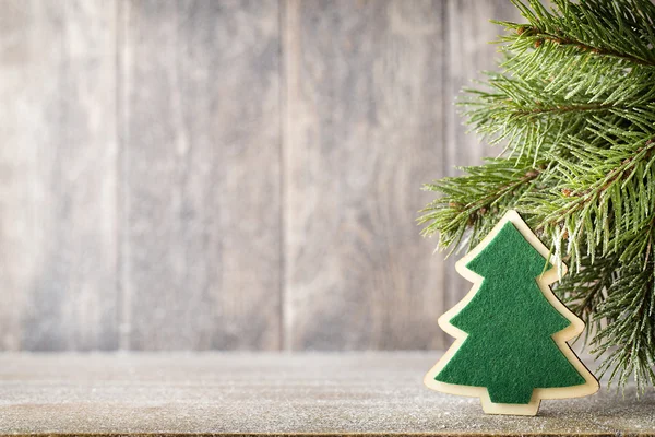 Christmas fir branch and decor, on the wooden background. — Stock Photo, Image