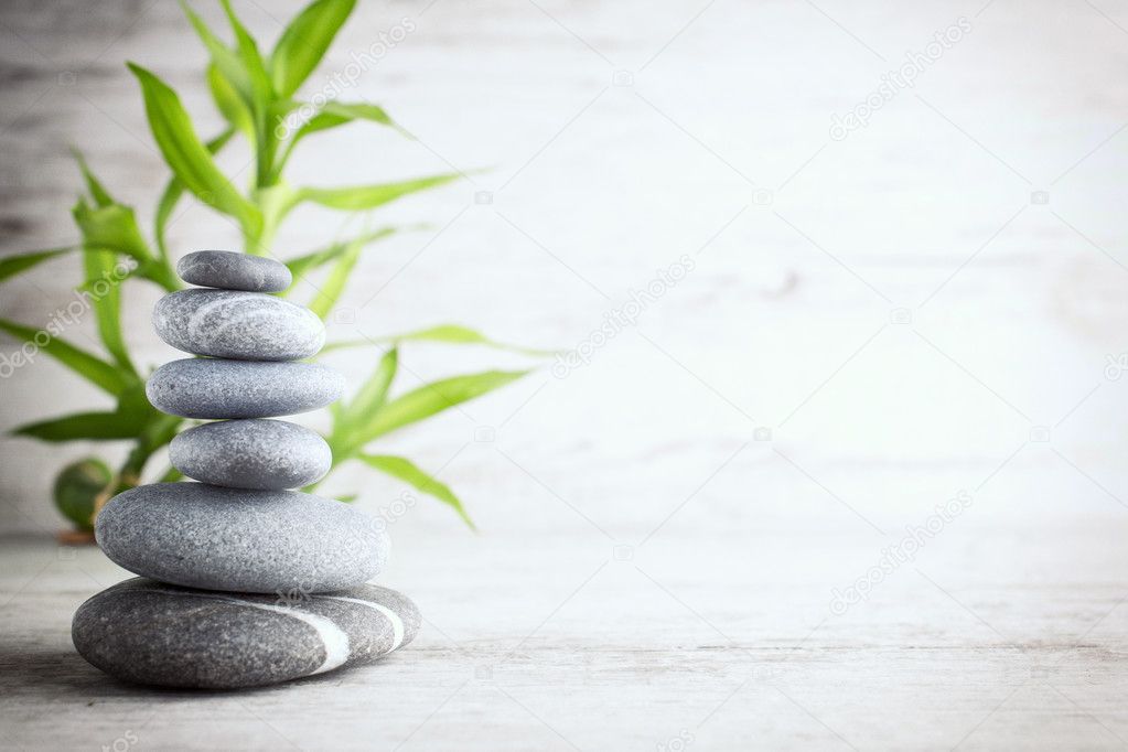 Spa stones on the grey background.