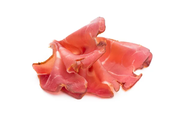 Fette di prosciutto su sfondo bianco . — Foto Stock