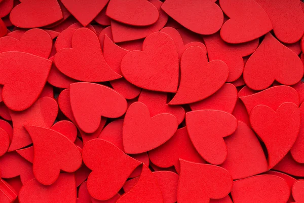 Fler små röda hjärtan bakgrund. — Stockfoto
