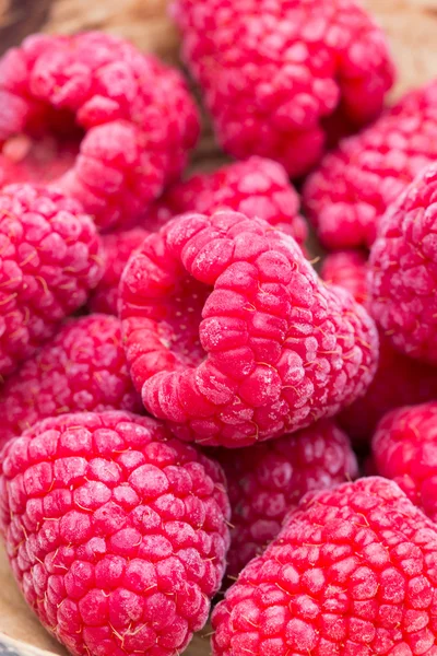 Frozen raspberries on wooden background. — Stock Photo, Image