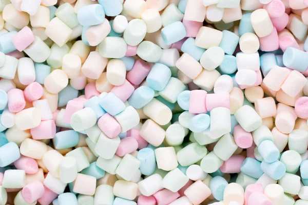 Bakgrund eller konsistens av färgglada mini marshmallows. — Stockfoto