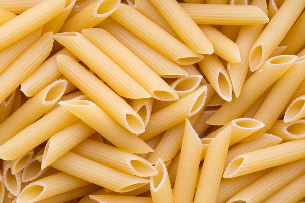 Italienska makaroner pasta full bakgrund. — Stockfoto