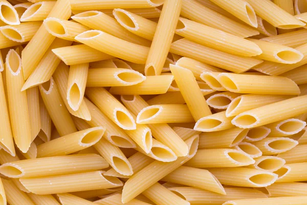 Macarrones italianos pasta fondo completo. — Foto de Stock