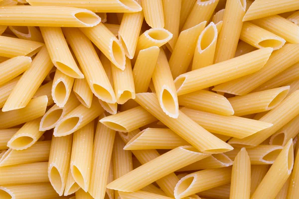 Italienische Makkaroni-Pasta voller Hintergrund. — Stockfoto
