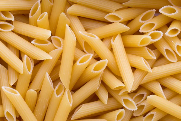 Italiaanse macaroni pasta volledige achtergrond. — Stockfoto