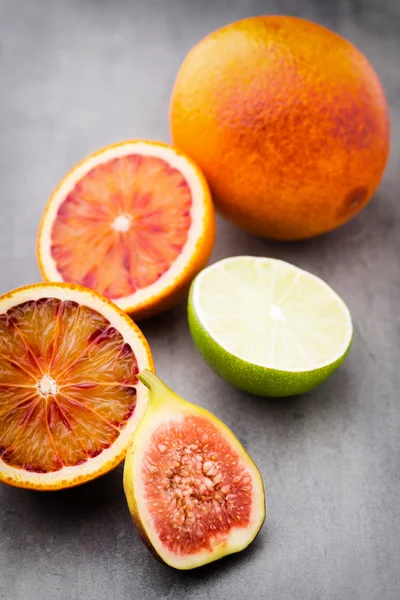 Bloody Sicilian oranges and figs. Shallow depth of field.