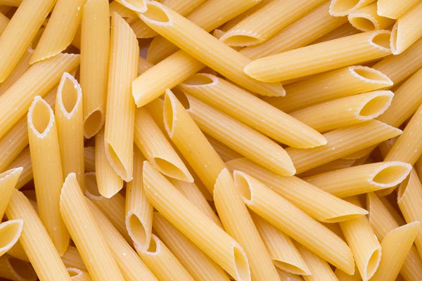 Italienska makaroner pasta full bakgrund. — Stockfoto